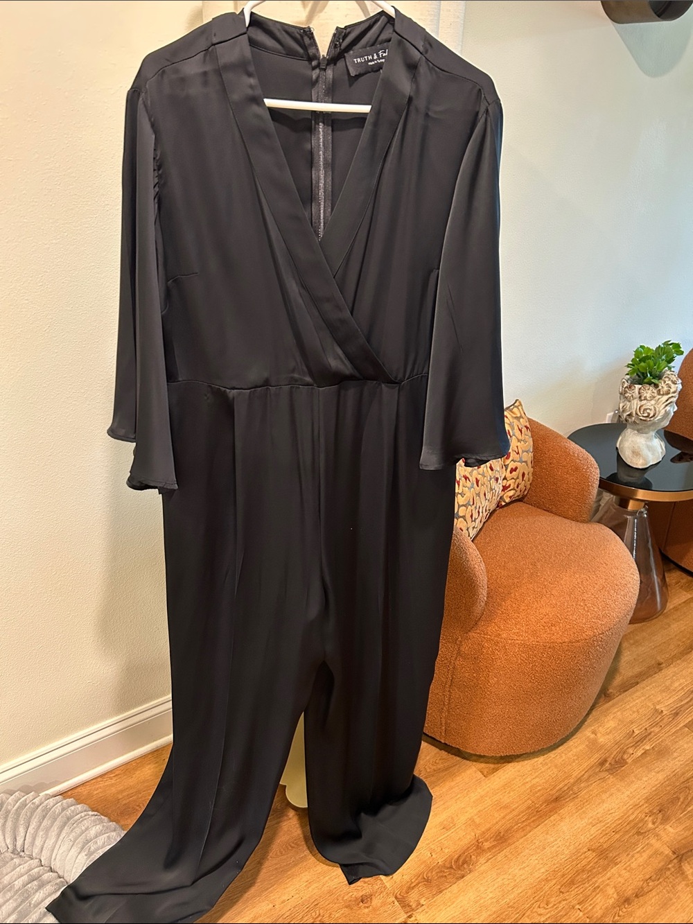 Black faux Wrap-Front Jumpsuit with V-Neck and 3/4 full Sleeves. Plus size